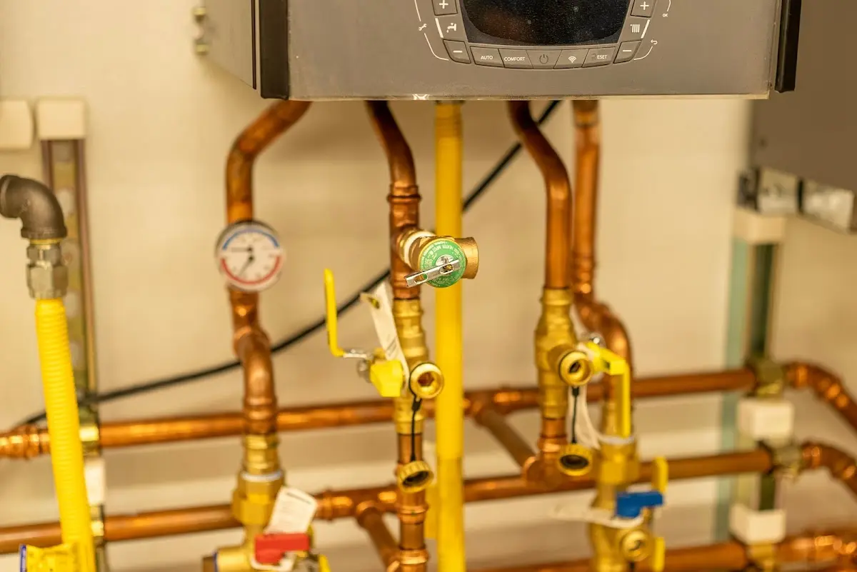 Licensed technician providing Water Heater Installation for a homeowner in Oscoda